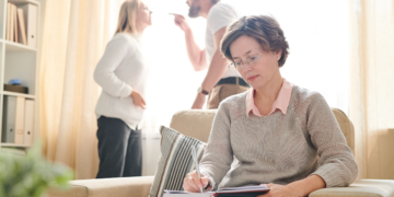 psychologist making notes while couple