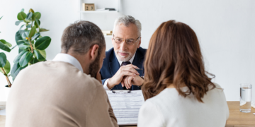 couple_with_a_lawyer_arguing_about_matrimonial_property