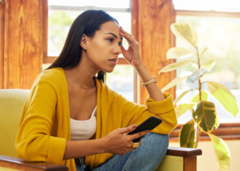 A single divorced mom looks baffled while making a decision.