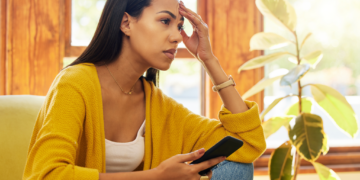 A single divorced mom looks baffled while making a decision.