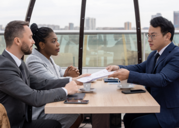A couple holds negotiations with a family lawyer.