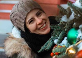 Girl enjoying Christmas decor outdoors