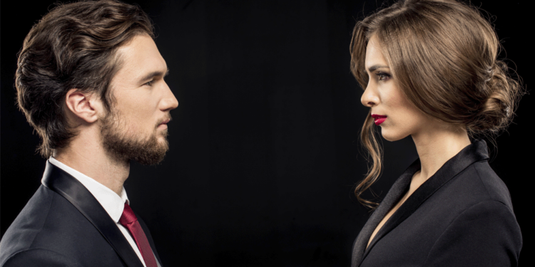 A couple looks into the eyes of each other.