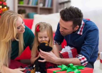 Loving family playing together on Christmas day