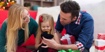 Loving family playing together on Christmas day