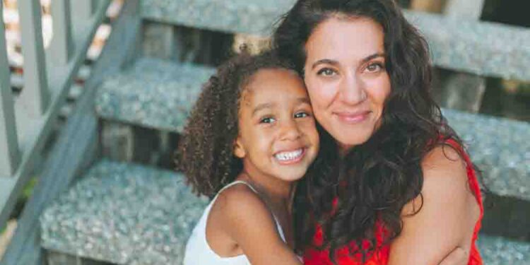 A portrait of a diverse mother and daughter.